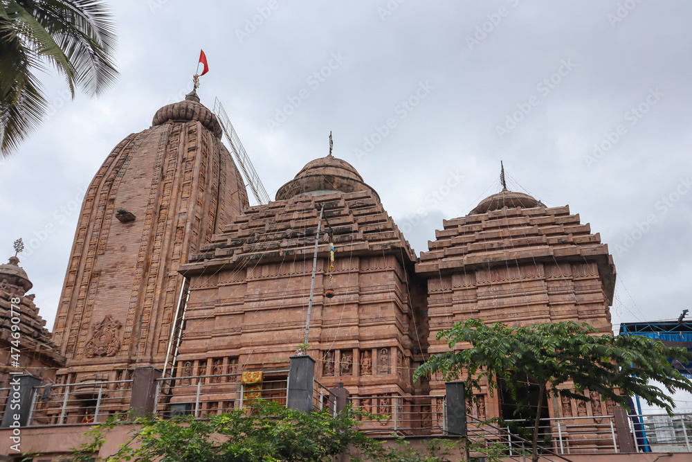 A Divine view of an Elegant Hindu temple built with red stone with architectural gopuram dedicated to Lord Jagganath of Orissa in India.