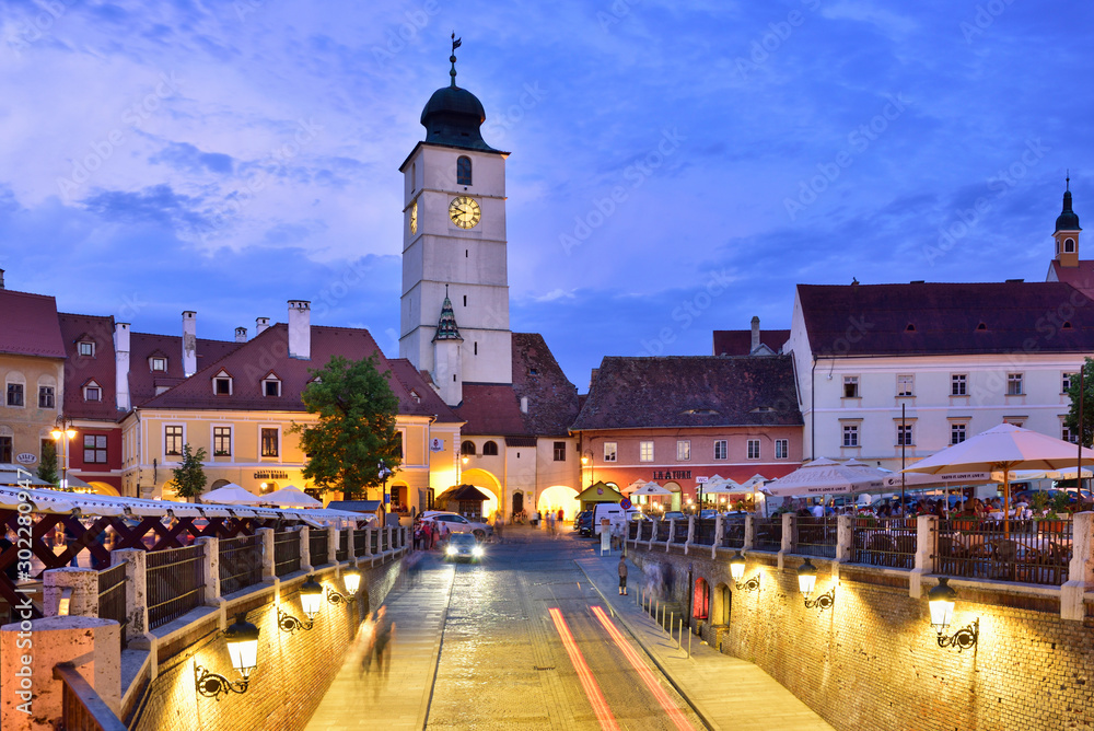 Old Town Hall Tower (Council Tower) and Piata Mica at dusk. Sibiu, Transylvania. Romania